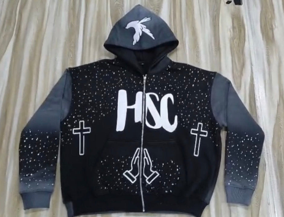 Black hoodie with white text and symbols on a neutral background